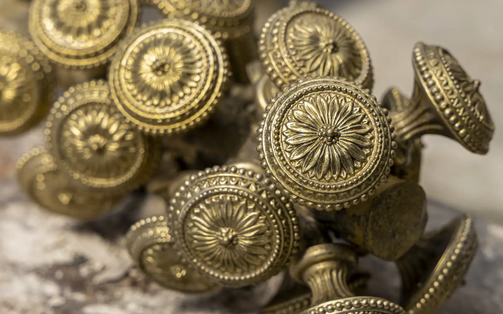 A tree of brass knobs after the lost wax process.